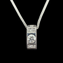 Load image into Gallery viewer, A brilliant and princess cut diamond pendant in platinum, with a white gold curb chain