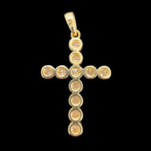 Load image into Gallery viewer, A round diamond cross pendant in yellow gold, on a black background
