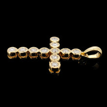 Load image into Gallery viewer, A round diamond cross pendant in yellow gold, on a black background