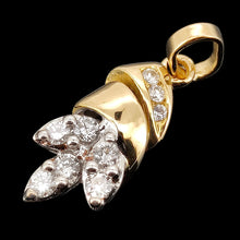 Load image into Gallery viewer, A yellow and white gold diamond set leaf shaped pendant, on a black background