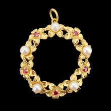 Load image into Gallery viewer, A yellow gold ruby and pearl flower open circle pendant, on a black background
