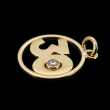 Load image into Gallery viewer, A yellow gold 30 pendant with a brilliant cut diamond