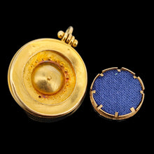 Load image into Gallery viewer, An antique locket back pendant in yellow gold, on a black background