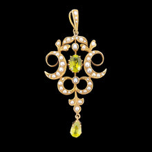 Load image into Gallery viewer, A peridot and pearl Art Nouveau style pendant in yellow gold, on a black background