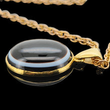 Load image into Gallery viewer, An oval banded agate pendant rubover set in yellow gold, with a yellow gold chain