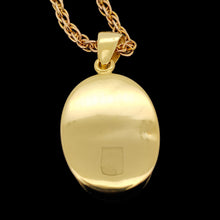 Load image into Gallery viewer, An oval pendant set in yellow gold, with a yellow gold chain