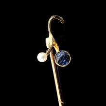 Load image into Gallery viewer, A sapphire and pearl tie pin in yellow gold, on a black background
