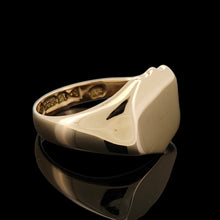 Load image into Gallery viewer, A yellow gold shield shaped signet ring, on a black background
