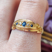 Load image into Gallery viewer, A yellow gold five stone sapphire and diamond ring, modelled on a hand
