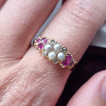 Load image into Gallery viewer, Gold ring with pearls, diamonds and rubies on a finger