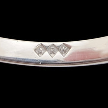 Load image into Gallery viewer, Close-up of an ARW sponsor's mark against a black background