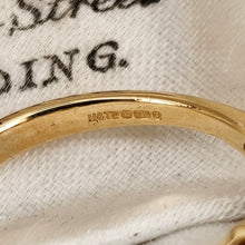 Load image into Gallery viewer, Close-up of an 18 carat gold hallmark inside a yellow gold ring shank