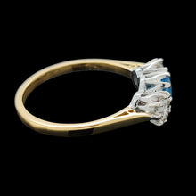 Load image into Gallery viewer, A three stone blue zircon and diamond ring in yellow and white gold