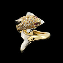 Load image into Gallery viewer, A yellow and white gold dolphin ring with diamonds and ruby eyes, on a black background