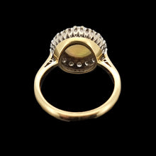 Load image into Gallery viewer, Gold ring with opal and diamond gemstones on a black background
