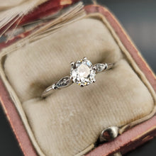 Load image into Gallery viewer, A diamond solitaire ring in platinum, in a ring box