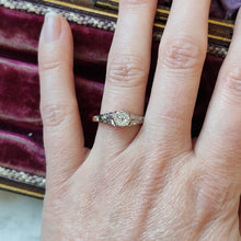 Load image into Gallery viewer, An old cut diamond solitaire ring in gold and platinum, modelled on a hand