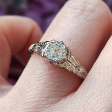 Load image into Gallery viewer, An old cut diamond solitaire ring in gold and platinum, modelled on a hand