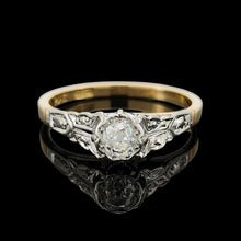 Load image into Gallery viewer, An old cut diamond solitaire ring in gold and platinum, on a black background