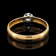 Load image into Gallery viewer, A single stone old cut diamond ring on a yellow gold band with white gold shoulder details