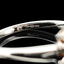 Load image into Gallery viewer, A close-up of an 18ct hallmark inside a white gold ring shank