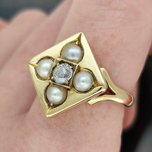 Load image into Gallery viewer, A pearl and diamond square shaped ring in yellow gold, modelled on a finger