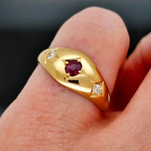 Load image into Gallery viewer, A three stone ruby and diamond ring in yellow gold, modelled on a hand