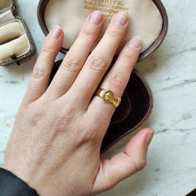 Load image into Gallery viewer, A yellow gold buckle band ring, modelled on a hand