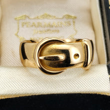 Load image into Gallery viewer, A yellow gold buckle band ring, in a ring box