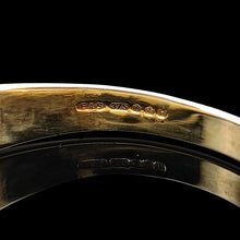 Load image into Gallery viewer, A close-up of a 9ct hallmark and maker's mark inside a yellow gold ring band, on a black background
