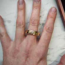 Load image into Gallery viewer, A yellow gold solitaire square cut diamond band, modelled on the middle finger of a hand