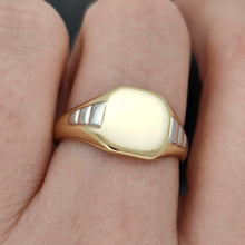 Load image into Gallery viewer, A yellow gold and platinum signet ring, modelled on a hand