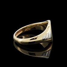 Load image into Gallery viewer, A yellow gold and platinum signet ring, on a black background