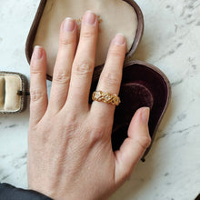 Load image into Gallery viewer, A yellow gold three stone diamond ring, modelled on a hand