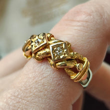 Load image into Gallery viewer, A yellow gold three stone diamond ring, modelled on a hand