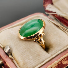 Load image into Gallery viewer, An oval shaped green jade ring in yellow gold, in an antique ring box