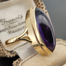 Load image into Gallery viewer, A yellow gold navette shaped cabochon cut amethyst solitaire ring, in a ring box