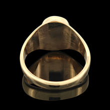 Load image into Gallery viewer, A yellow gold oval turquoise solitaire ring, on a black background