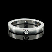 Load image into Gallery viewer, A round diamond set wedding band in white gold, on a black background