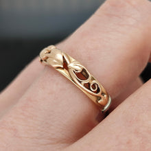 Load image into Gallery viewer, A yellow gold leaf motif band ring, modelled on a hand