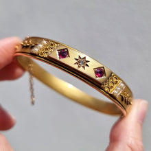 Load image into Gallery viewer, Edwardian 9ct Gold Ruby, Diamond & Seed Pearl Bangle in hand