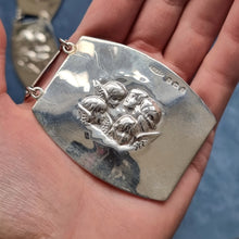 Load image into Gallery viewer, Edwardian Sterling Silver Cherub Panel Belt by Sampson Mordan & Co in hand