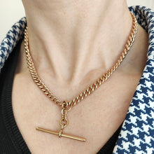Load image into Gallery viewer, A rose gold curb link Albert chain with T-bar, modelled on a neck
