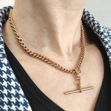 Load image into Gallery viewer, A rose gold curb link Albert chain with T-bar, modelled on a neck
