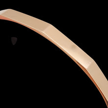 Load image into Gallery viewer, Close-up of a rose gold bangle

