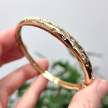 Load image into Gallery viewer, Vintage 18ct Gold Brilliant Cut Diamond Hinged Bangle in hand
