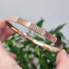 Load image into Gallery viewer, Art Deco 9ct Rose Gold Engine Turned Engraved Bangle in hand
