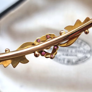 Antique 9ct Gold Ruby and Seed Pearl Heart Bangle behind