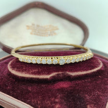 Load image into Gallery viewer, A yellow gold diamond bangle bracelet, in an antique box
