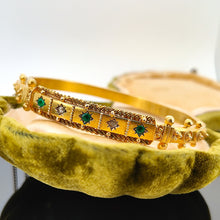 Load image into Gallery viewer, A yellow gold Etruscan style bangle bracelet set with emeralds and diamonds in an antique box
